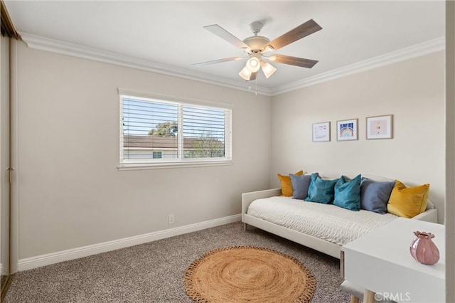 living area featuring carpet flooring, ceiling fan, and crown molding