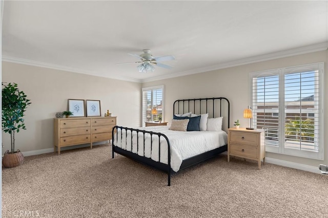 bedroom featuring ceiling fan, ornamental molding, and carpet floors