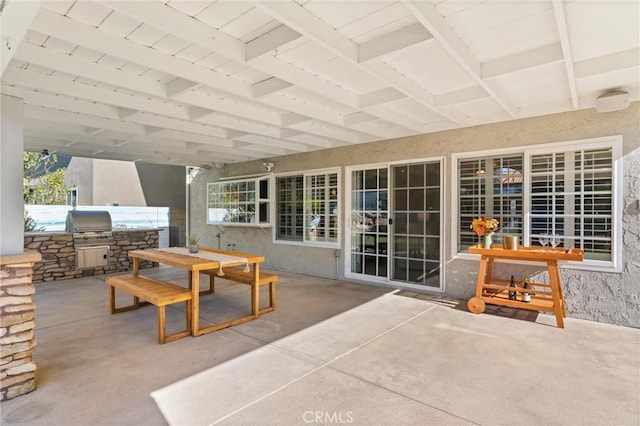 view of patio featuring exterior kitchen and grilling area