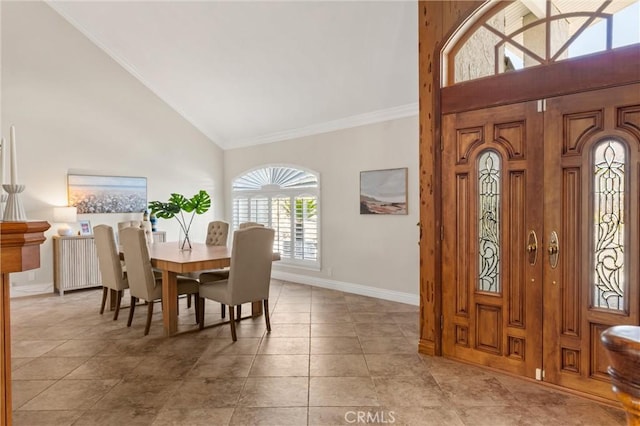 tiled dining area with radiator heating unit and high vaulted ceiling