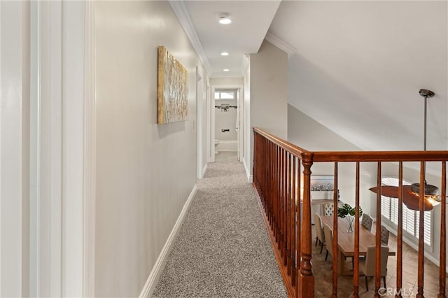 corridor featuring crown molding and carpet flooring