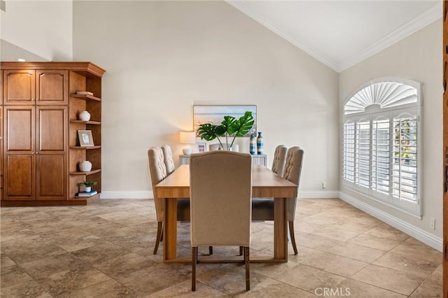 dining space with high vaulted ceiling and ornamental molding