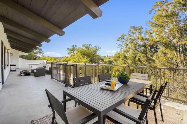 balcony with an outdoor hangout area and a patio area