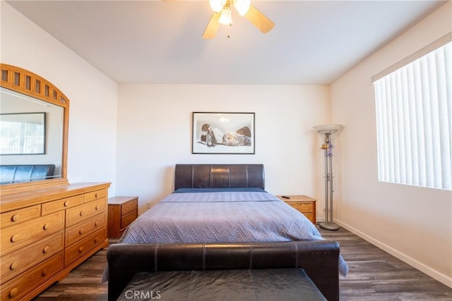 bedroom with ceiling fan and dark hardwood / wood-style floors