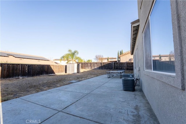 view of patio / terrace featuring central air condition unit and a storage unit