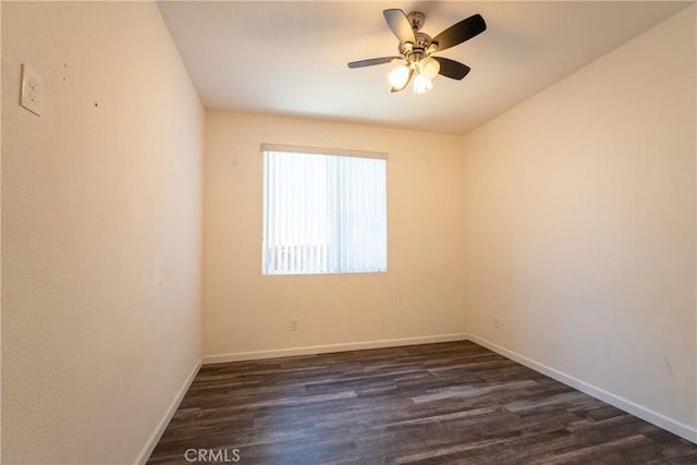 spare room with ceiling fan and dark wood-type flooring