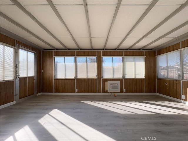 unfurnished sunroom featuring heating unit