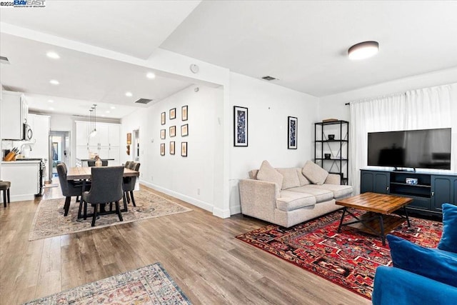 living room with wood-type flooring