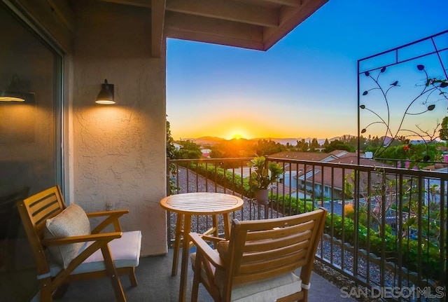 view of balcony at dusk