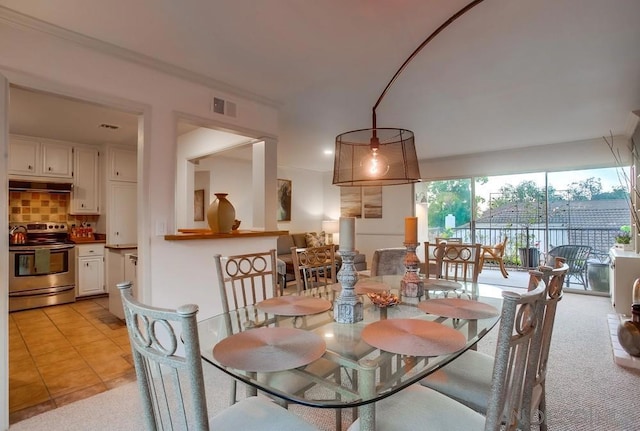 dining area featuring light tile patterned floors