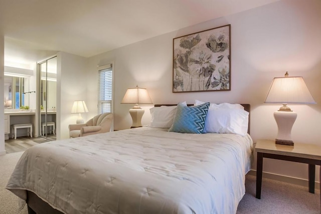 carpeted bedroom with a closet