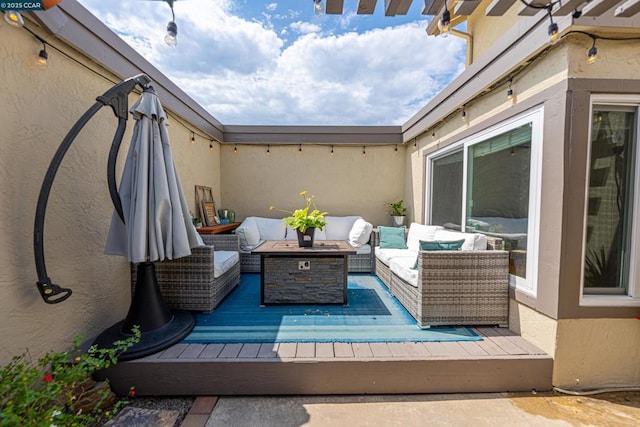 view of patio featuring a deck and an outdoor living space