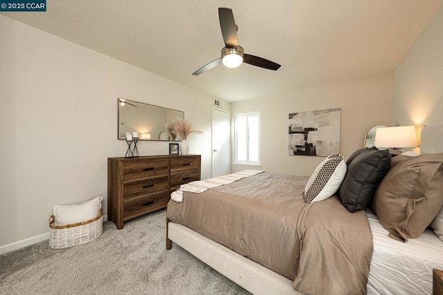 bedroom featuring ceiling fan and light carpet