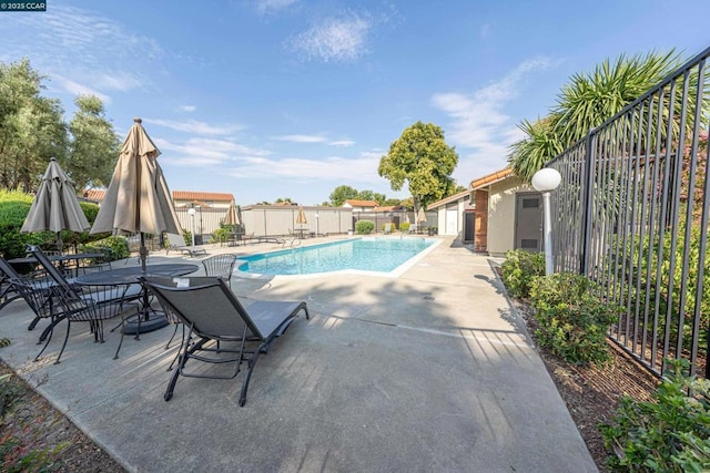 view of pool featuring a patio area