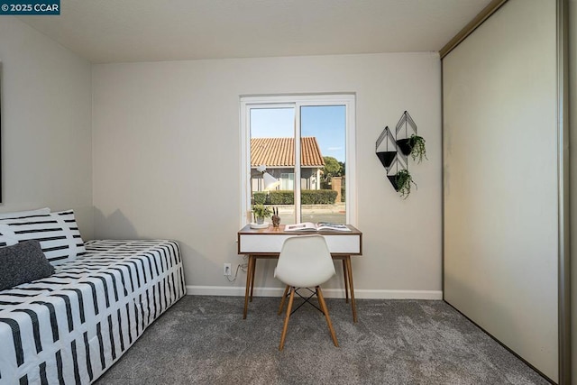 bedroom featuring dark colored carpet