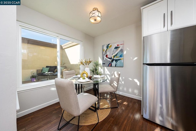 dining area with dark wood-type flooring