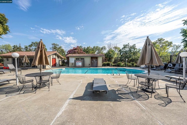 view of swimming pool featuring a patio