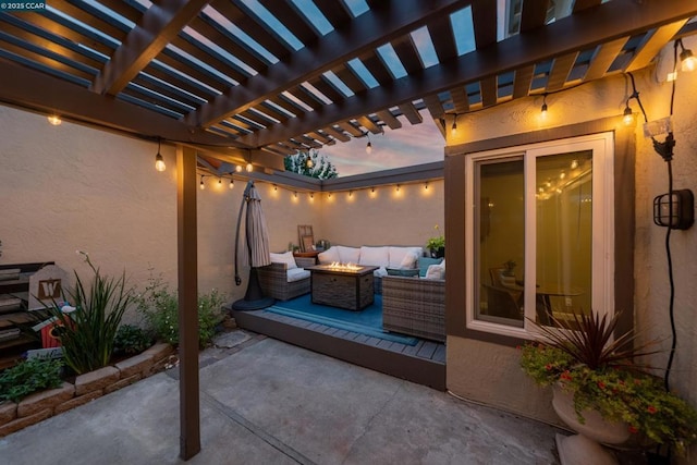 view of patio / terrace featuring an outdoor living space with a fire pit and a pergola