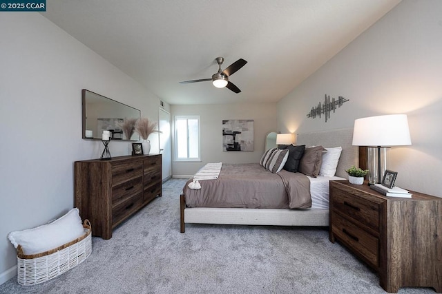 bedroom featuring light colored carpet and ceiling fan