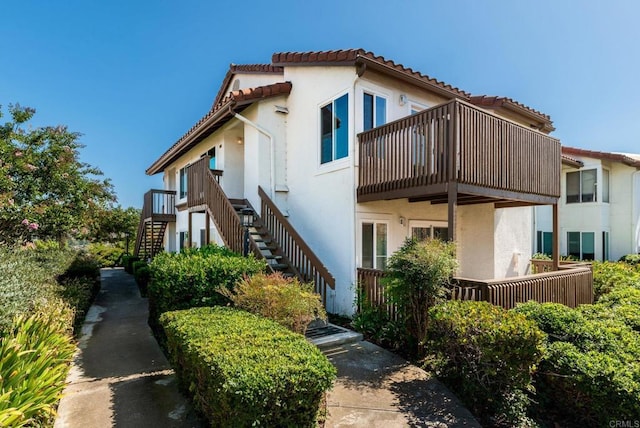 view of property exterior featuring a balcony