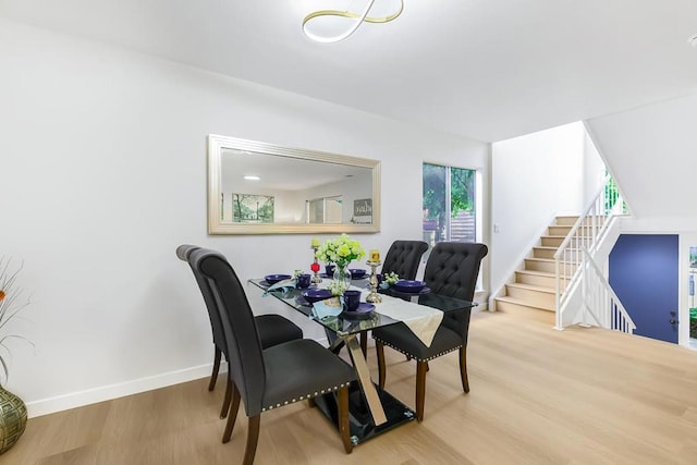 dining area with wood-type flooring