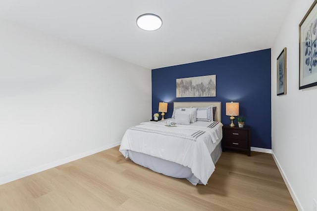 bedroom featuring hardwood / wood-style floors