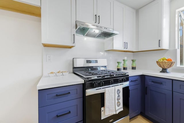 kitchen with gas stove, white cabinetry, and blue cabinetry