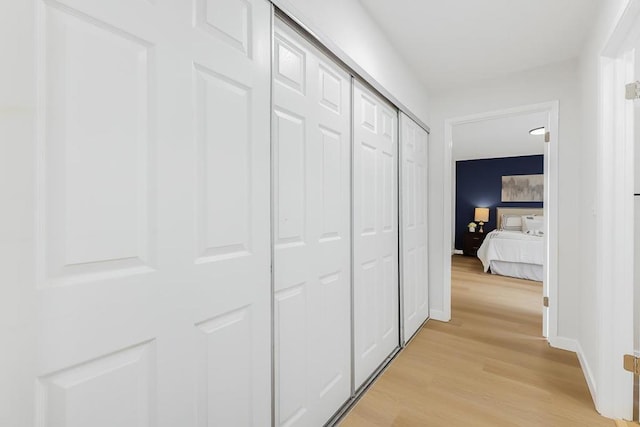 corridor featuring light hardwood / wood-style floors