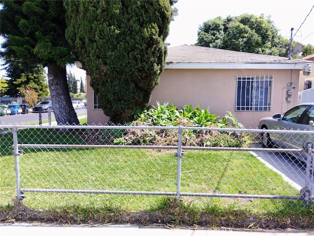 view of side of property with a lawn