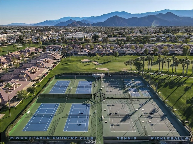 birds eye view of property with view of golf course, a residential view, and a mountain view