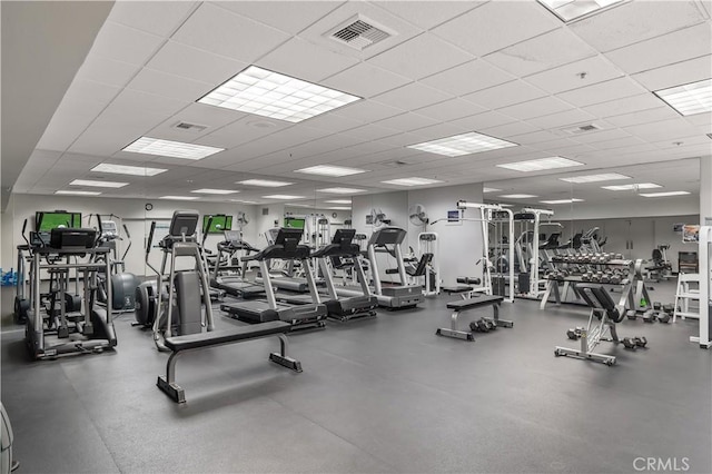 gym featuring a paneled ceiling and visible vents