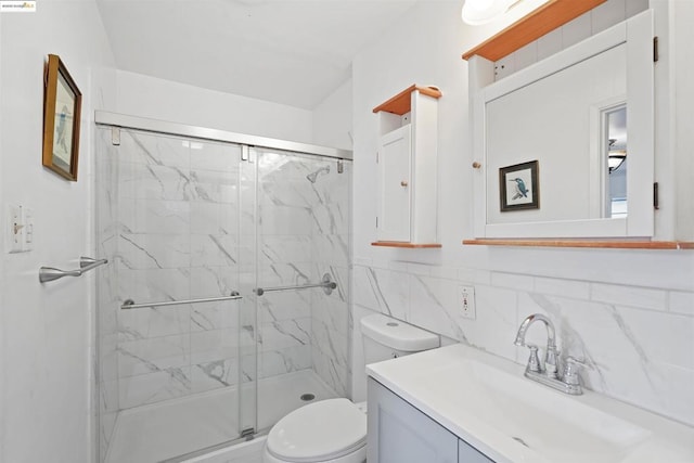 bathroom featuring vanity, an enclosed shower, tile walls, and toilet