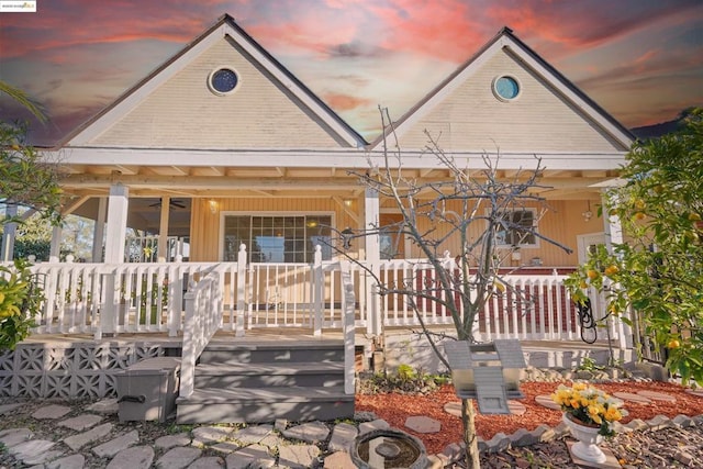 view of front facade featuring ceiling fan and covered porch