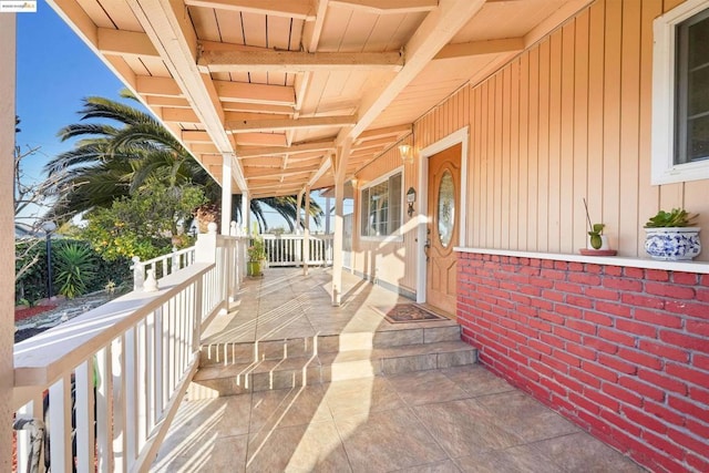 view of patio featuring a porch