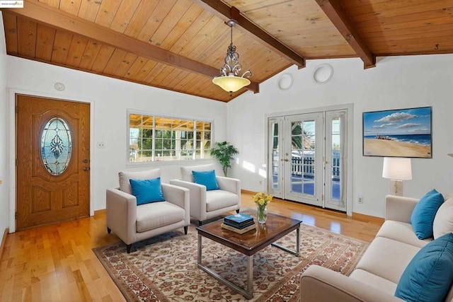 living room with wood ceiling, lofted ceiling with beams, and light wood-type flooring