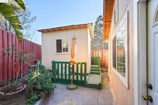 exterior space with a patio and a storage shed