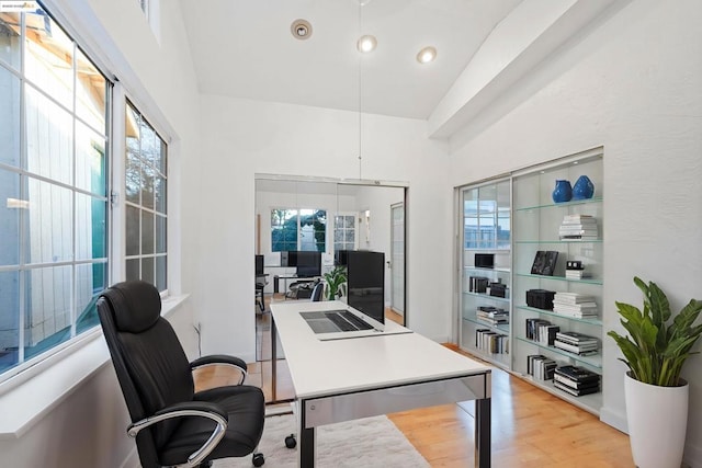 office area with light hardwood / wood-style floors