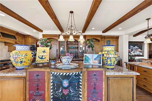 kitchen featuring a center island, a chandelier, hanging light fixtures, and beam ceiling