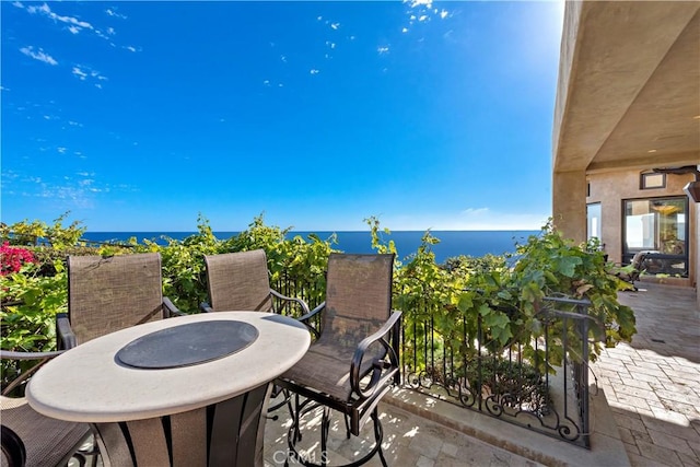 view of patio with a water view