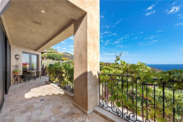 balcony featuring a water view