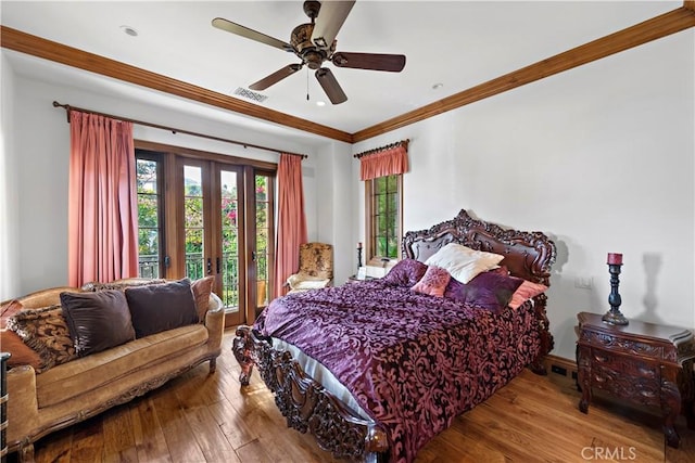 bedroom with ceiling fan, crown molding, and hardwood / wood-style floors