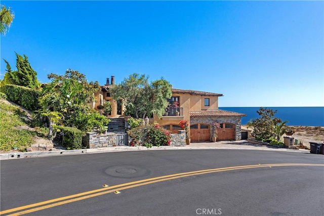 view of front of house featuring a water view