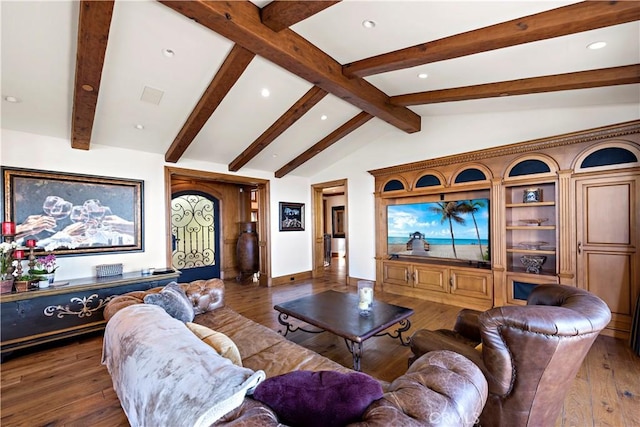 living room featuring vaulted ceiling with beams and dark wood-type flooring