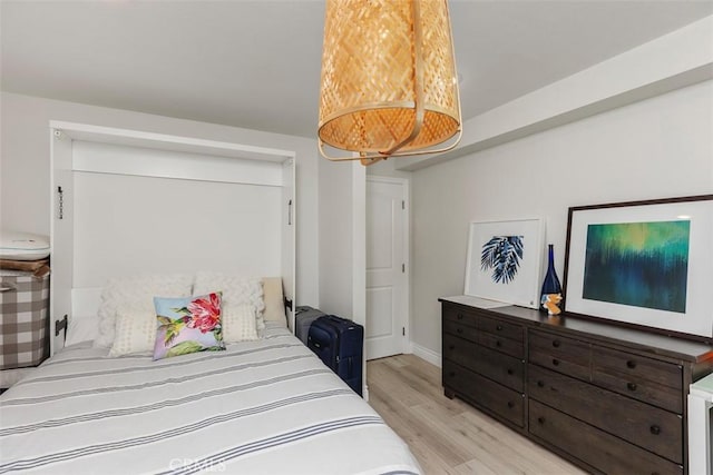 bedroom with light hardwood / wood-style floors