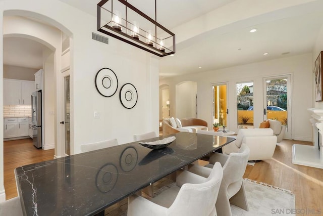 dining space with light hardwood / wood-style floors