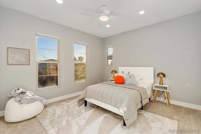 carpeted bedroom featuring ceiling fan