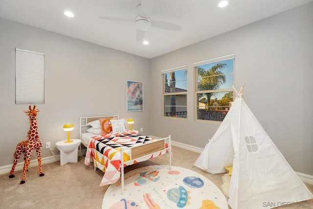 bedroom featuring ceiling fan and light colored carpet