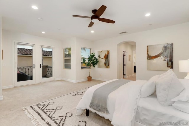 carpeted bedroom with ceiling fan and access to outside