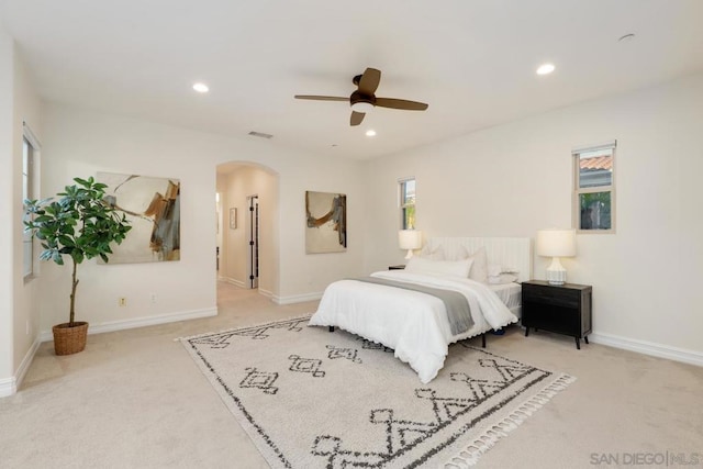 carpeted bedroom with ceiling fan