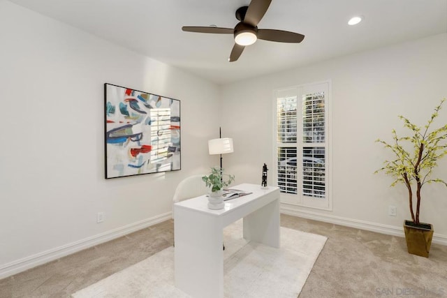 office area featuring ceiling fan and light colored carpet